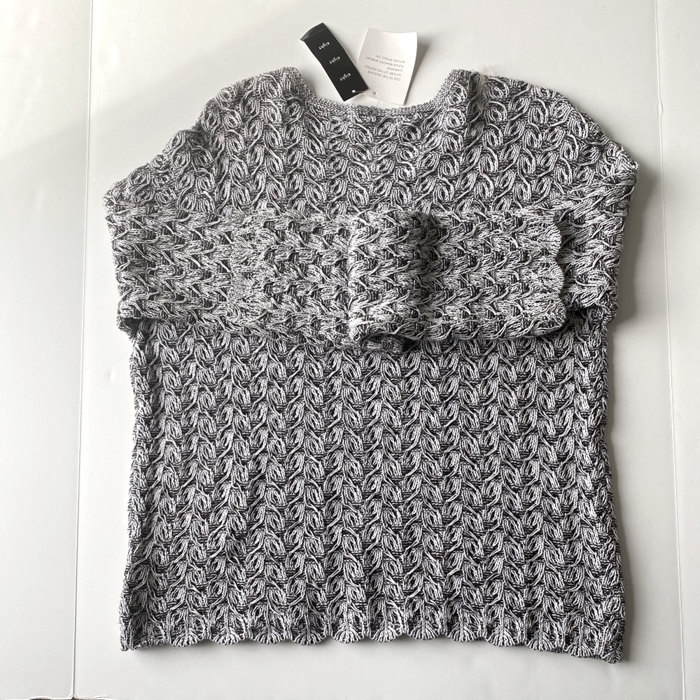 eight eight eight. Black and white knitted sweater